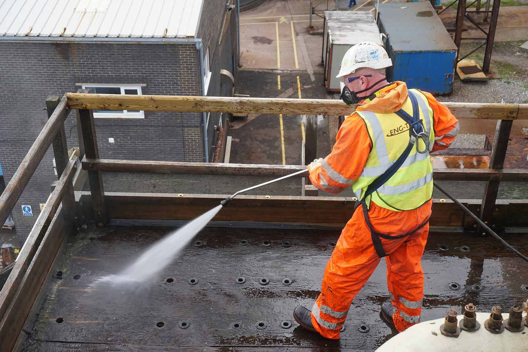 Engineer cleaning cooling tower components