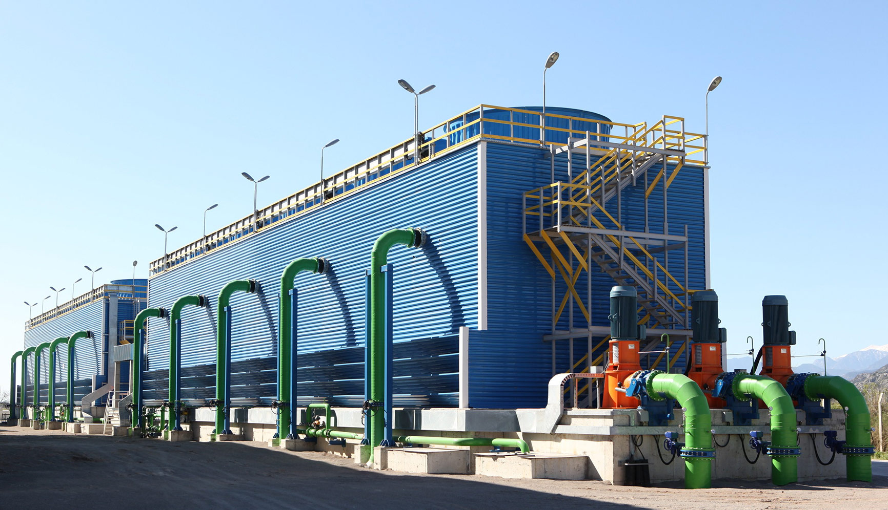 ENG-TECH cooling tower installation with blue cladding and green pipework
